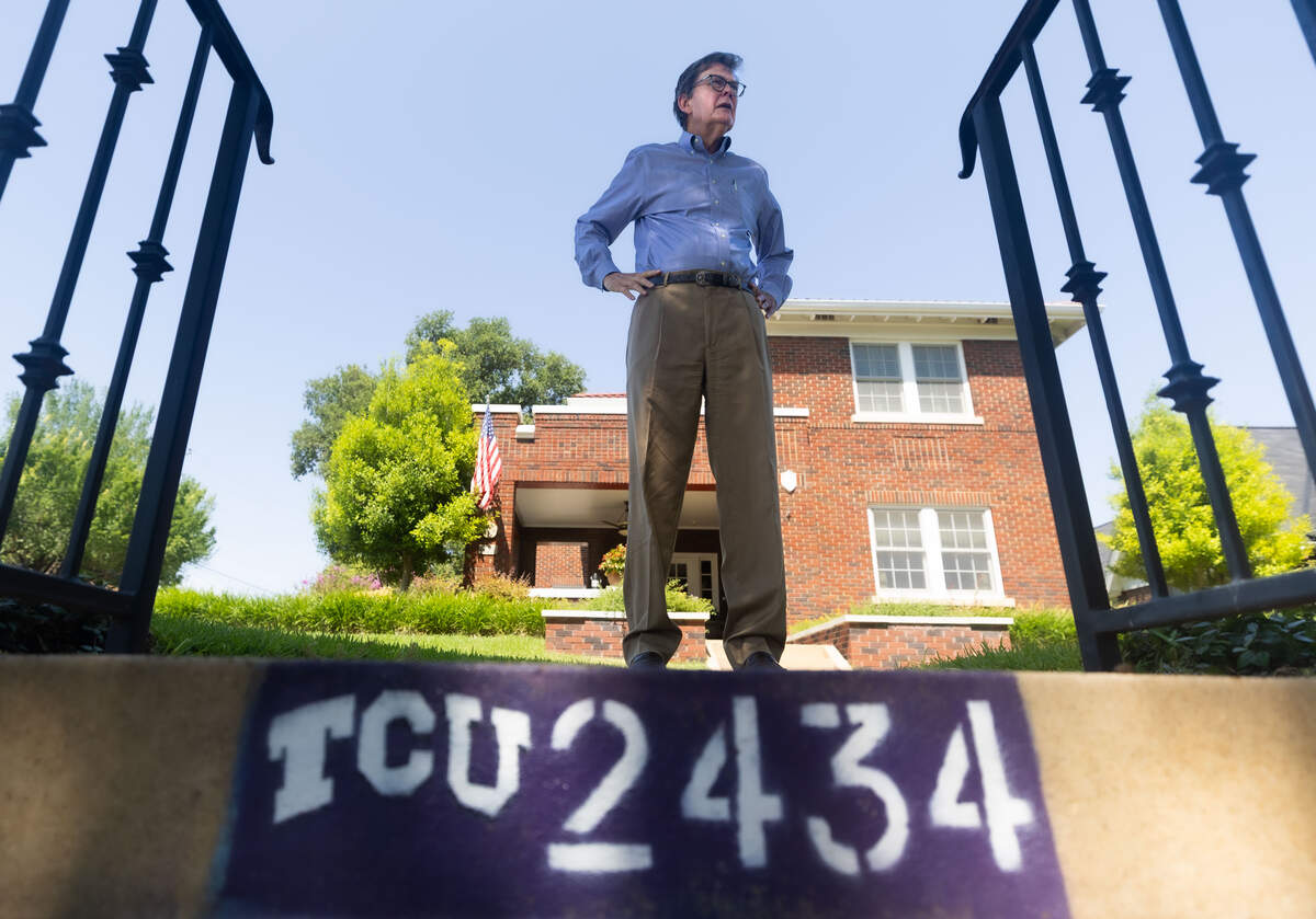 Michael Johnston stands in front of his home in Fort Worth on July 6, 2026. Living next to Texas Christian University for more than 40 years, Johnston says that he wishes the university would have better communication with residents when it comes to expansions.